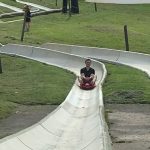Chenxi demonstrating a safe way to use the alpine slide. 